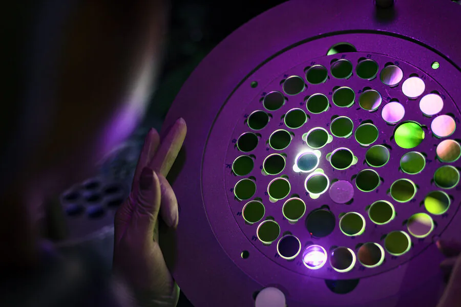 Color-filtered laser optics under inspection light